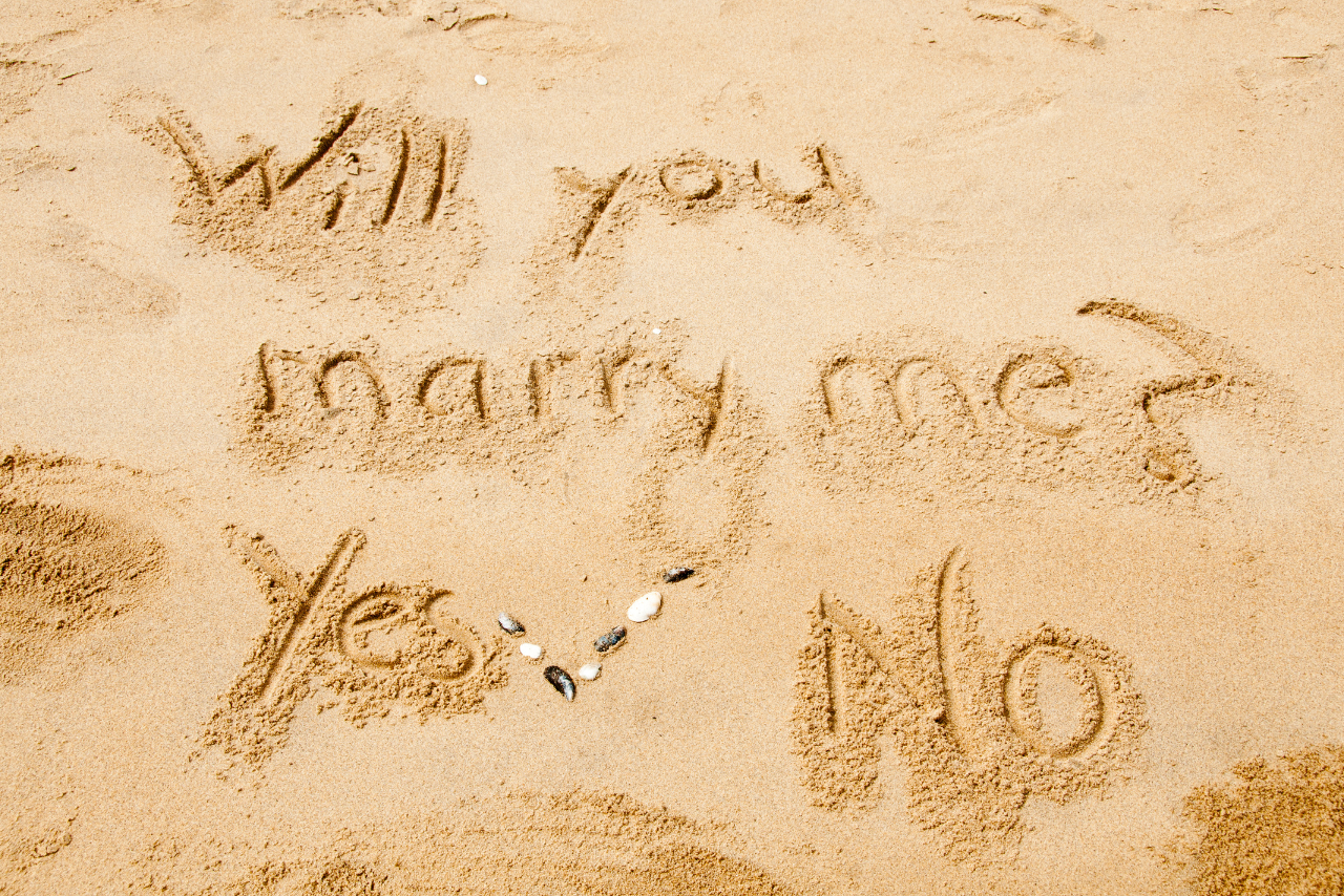 will you marry me in the beach sand